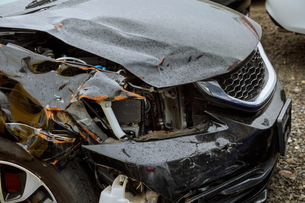 Detail with damage automobile after a car crash accident Closeup